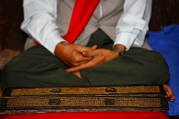 Man reading Buddhist scriptures, Golden temple, Patan, Nepal, Asia