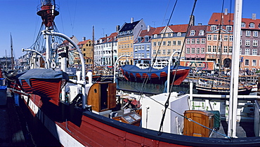 Moored boats and the waterfront of the Nyhavn Channel, the old harbour of Copenhagen, Denmark, Europe