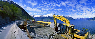 Earth moving machinery used for widening Route 13 along Hardangerfjord in Hordaland, Norway, Scandinavia, Europe