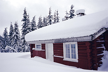 Snow covered log built house, Norway, Scandinavia, Europe