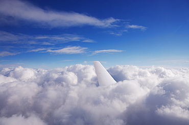 Aircraft tail fin in clouds