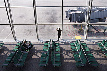 Man wan waiting at airport gate, Chek Lap Kok Airport, Hong Kong, China, Asia