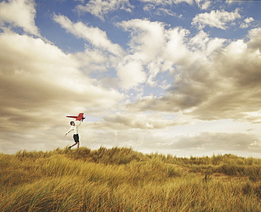 Little boy playing with model plane