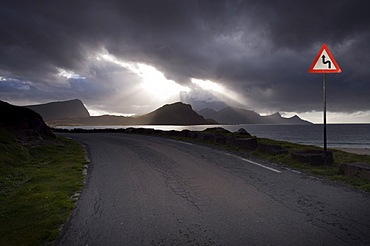 Empty road running alongside fjord, Norway, Scandinavia, Europe