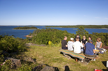 Having a picnic on the cliffside of the Aland archipelago, Finland, Scandinavia, Europe