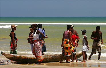 Vezo women buying fish on the beach of Morondava, Madagascar, Africa