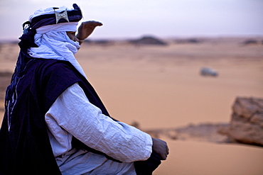 A Tuareg dressed for celebrations at the entrance of the Dar Sahara tented camp in the Fezzan desert, Libya, North Africa, Africa