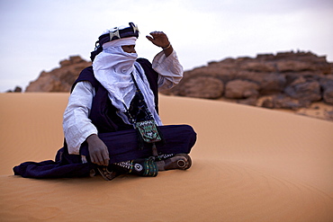 A Tuareg dressed for celebrations at the entrance of the Dar Sahara tented camp in the Fezzan desert, Libya, North Africa, Africa