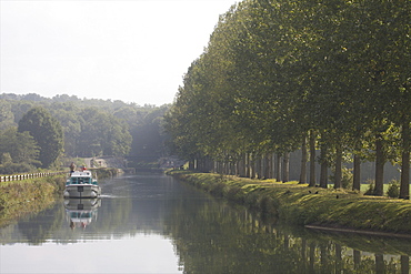 Navigation at dawn on the Saone river in Franche-Comte, France, Europe