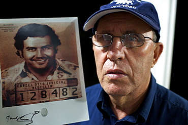 Roberto Escobar with a picture of his brother Pablo, Medellin, Colombia, South America