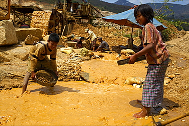 Boys searching for ruby stones in Mogok mining sites, Myanmar (Burma), Asia