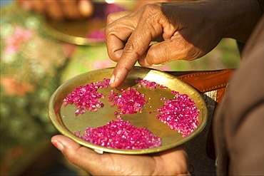 Small ruby stones bought by buyers on the market of Mogok, Myanmar (Burma), Asia