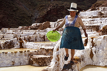 People working in the Salinas de Maras, Sacred Valley, Peru, South America