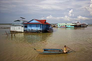 A small boat close to the floating village of Kompong Phluk on Lake Tonle Sap, close to Siem Reap, Cambodia, Indochina, Southeast Asia, Asia