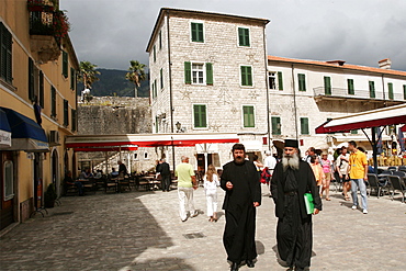 Two priests on the market square of the city of Kotor, Montenegro, Europe