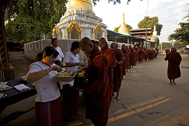 Monks being served by the Road to Mandalay crew, Myanmar (Burma), Asia