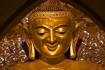 Detail of the Buddha statue iInside the Ananda temple in Bagan, Myanmar (Burma), Asia