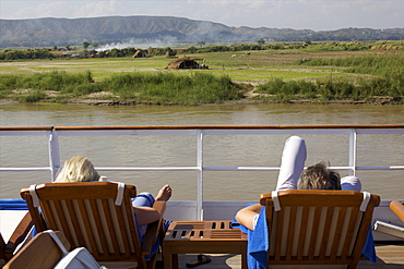 View of the shore of the Irrawaddy River, from the upper deck of the Road to Mandalay cruise boat, Myanmar (Burma), Asia