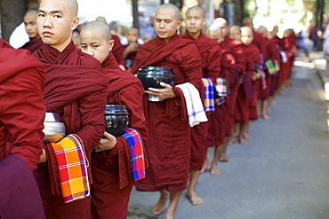 In the Amarapura monastery, close to U Bein bridge, some monks queuing for lunch, Myanmar (Burma), Asia