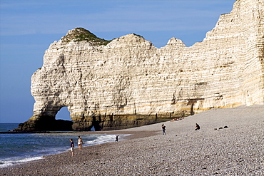 A pebble beach of Etretat and the cliffs of the Cote d'Albatre, Seine Maritime, Normandy, France, Europe