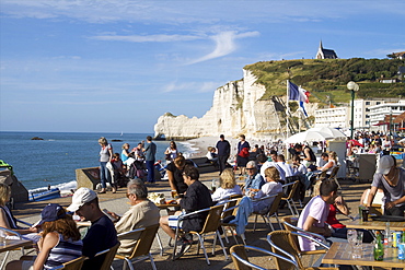 Having a drink on the sea front of Etretat in a boat bar, Etretat, Seine Maritime, Normandy, France, Europe