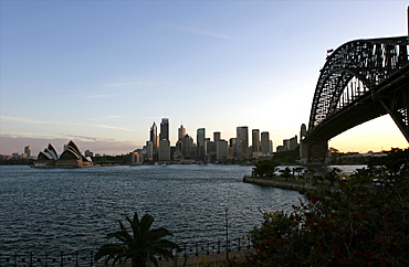 View of the city including the Harbour Bridge and Opera House, from Millson Point Park, Sydney, New South Wales, Australia, Pacific