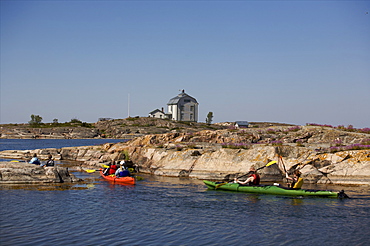 Canoeing along the coast of the Kobba Klintar island in the Aland archipelago, Finland, Scandinavia, Europe