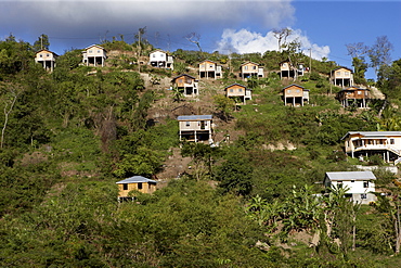 Small hillside houses built on stilts, Grenada, Windward Islands, West Indies, Caribbean, Central America