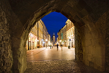 The archway of the Florian Gate, the main entrance into the city, looking down the Royal Road, Krakow, Poland, Europe