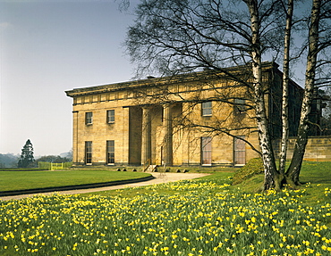 East front of Belsay Hall dating from 1817, in spring with daffodils, Northumberland, England, United Kingdom, Europe
