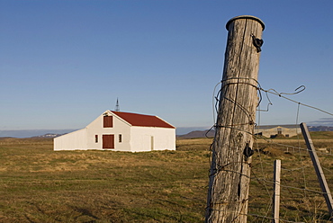 Fence and a lonely farm in Central Iceland, Iceland, Polar Regions