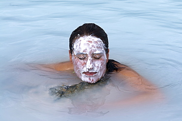 Woman enjoying the healing water of the blue lagoon, Reykjavik, Iceland, Polar Regions