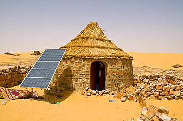 Traditional house with a solar panel in the Sahara Desert, Algeria, North Africa, Africa