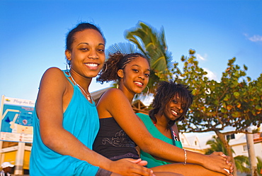 Three girls of La Reunion at the beach of Saint Gilles des Baines, La Reunion, Indian Ocean, Africa