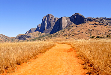 Road leading to granite rocks in the Andringitra National Park, Madagascar, Africa