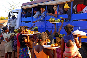 Women selling fruit to people in a local bus, Toliara, Madagascar, Africa