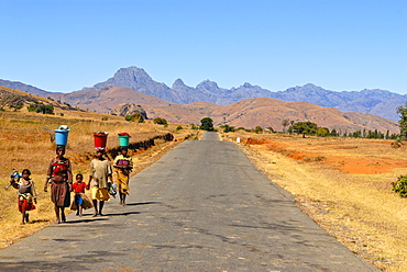 People walking along a street in the background Pic Bobby (Pic d'Imarivolanitra) in the Andringitra National Park, Madagascar, Africa