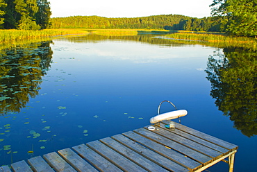 Little pier at peaceful lake in the Aukstaitija National Park, Lithuania, Baltic States, Europe