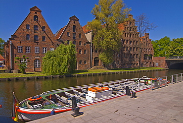 Boat on a little channel in front of the salt warehouses, Lubeck, UNESCO World Heritage Site, Schleswig-Holstein, Germany, Europe