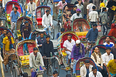 Busy rickshaw traffic on a street crossing in Dhaka, Bangladesh, Asia