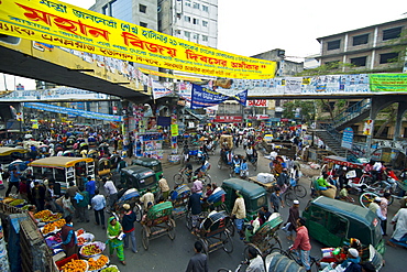 Busy rickshaw traffic on a street crossing in Dhaka, Bangladesh, Asia