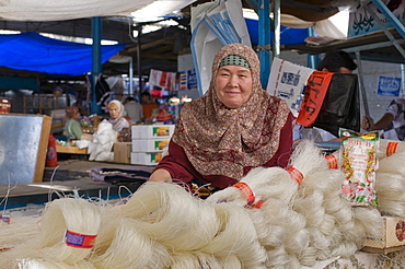 Woman selling rice noodles, Osh, Kyrgyzstan, Central Asia, Asia