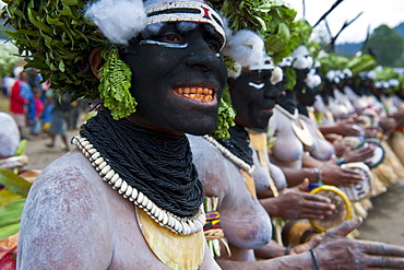 Colourfully dressed and face painted local ladies celebrating the traditional Sing Sing in the Highlands, Papua New Guinea, Pacific