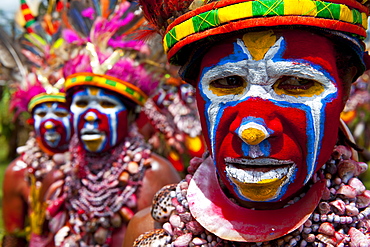 Colourfully dressed and face painted local tribes celebrating the traditional Sing Sing in the Highlands, Papua New Guinea, Pacific