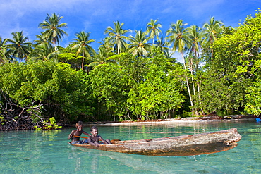 Young boys fishing in the Marovo Lagoon, Solomon Islands, Pacific