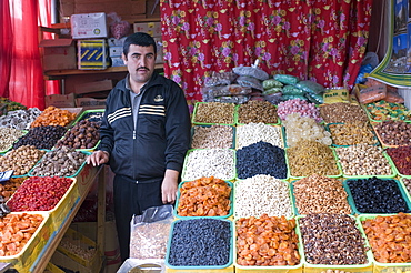 Shopseller in the bazaar selling dried fruits, Almaty, Kazakhstan, Central Asia, Asia