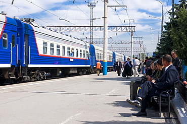 Railway station with passengers and train, Almaty, Kazakhstan, Central Asia, Asia