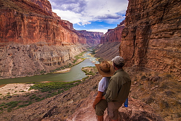 Tourists at the Nankoweap Viewpoint admiring the scenery, seen while rafting down the Colorado River, Grand Canyon, Arizona, United States of America, North America