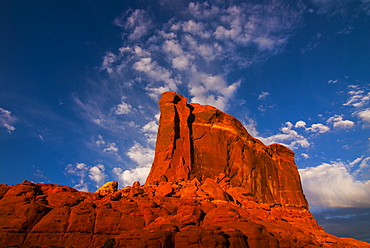 Giant rock in the late afternoon light on top of a plateau near Moab, Utah, United States of America, North America