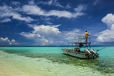 Little motor boat in the turquoise waters of the Ant Atoll, Pohnpei, Micronesia, Pacific